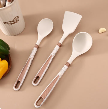 Set 11 ustensile de bucatarie din silicon si suport depozitare crem marmorat si accente bronze